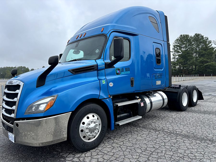 The Loaded Logistics Freightliner Cascadia, blue with the Loaded Logistics logo on the cab door.